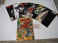 Seven Daredevil comics including one older colorful issue and six from Fall From Grace story.