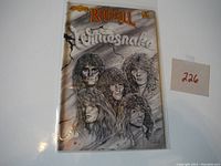 Rock & Roll Comics Whitesnake comic book with band member illustrations on cover, in protective sleeve.