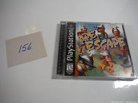 Front view of Ape Escape PlayStation game in jewel case with cover art and rating visible.
