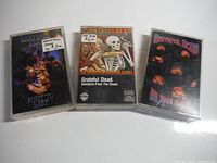 Three Grateful Dead cassette tapes showing front album cover artwork: Built to Last, Skeletons From The Closet, and In The Dark.