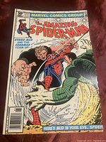 Front cover of Marvel Comics The Amazing Spider-Man #217 featuring Spider-Man battling Hydro-Man and Sandman.