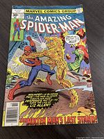Front cover of Amazing Spider-Man #173 comic book showing Spider-Man fighting The Molten Man with bright colors and comic style text.