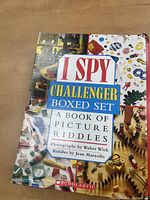 Front of boxed set containing 5 I SPY Challenger books with colorful photographic cover art, title in red, blue, and white text.