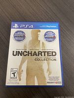 Front cover of Sony PS4 game Uncharted: The Nathan Drake Collection case showing the included games and PlayStation branding.
