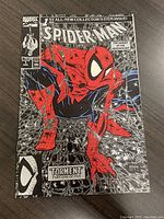 Front cover showing Spider-Man in red and black on a silver webbing background, marked as issue #1 'Torment' Part One of Five from August 1990.
