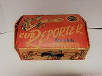Original box with handle and colorful graphics