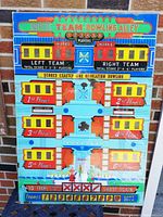 Front view of the colorful plexiglass back glass showing the detailed scoreboard and game graphics for Uniteds Team Bowling Alley from 1958.