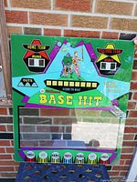 Front view of Williams Base Hit arcade game back glass showing colorful graphics and measurement reference.