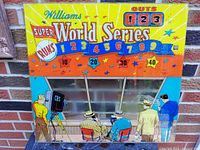 Front view of the colorful Williams Super World Series 1962 arcade back glass showing score and baseball game scene.