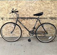 Full side view of the Firenze MT 505 mountain bike showing the black frame, wheels, and seat.
