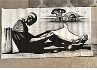 Full view of hand painted African art on cloth showing seated figure and village scenery with tree and hut, signed, no frame