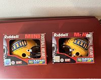 Two boxed Riddell Super Bowl XXXIII mini football helmets side by side
