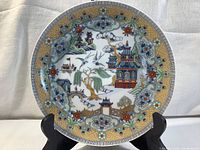 Full front view of the Japanese decorative plate showing detailed artwork and border pattern