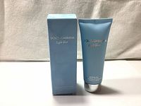 Front view of Dolce & Gabbana Light Blue Refreshing Body Cream 100ml tube with matching box, showing branding and product name.