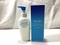 Photo of the Shiseido cleansing oil bottle and its blue packaging box, displaying the front labels and branding.