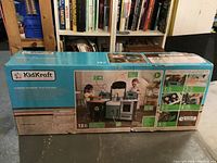 Box showing full KidKraft Garden Gourmet Play Kitchen set with images of the assembled kitchen and features