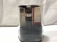 Peugeot Epivac Duo vacuum pump and stoppers in clear acrylic case with slight cracks visible.