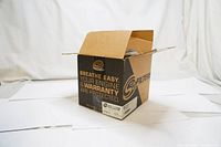 S&B branded cardboard box open showing packaging of the air filter inside.