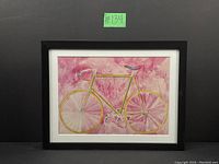 Full view of framed bike print against black background showing the entire artwork and frame.