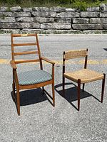 Both chairs photographed outside on pavement with a stone wall behind