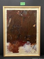 Framed mixed media artwork by Andrea Bolley featuring dark brown layered acrylic and collage on paper with textured abstract composition.