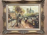 Framed oil painting of a Parisian scene with trees, people, carriage and Notre Dame style cathedral in the background.