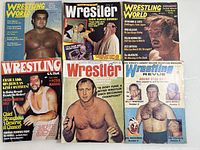 Six wrestling magazines arranged in two rows of three, showing different vintage cover designs from the 1970s, each featuring wrestlers.