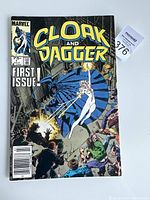 Front cover of Cloak and Dagger comic book showing main characters and title indicating first issue and Marvel branding.