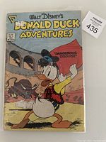 Front cover of Walt Disney's Donald Duck Adventures Comic Book Issue No. 2, December 1987, showing Donald Duck in a matador costume with a bull in the background and story title 'Dangerous Disguise!'