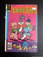 Front cover of Looney Tunes comic book showing Bugs Bunny, Porky Pig, and other characters.