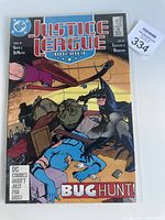 Front cover of Justice League America comic book with Bug Hunt story and DC Comics branding