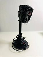 Front view of F13 USB desktop microphone on stand with cable wrapped around base