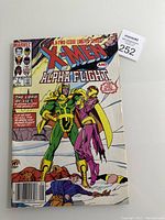 Front cover of Marvel X-Men and Alpha Flight comic book showing characters in combat and title header.