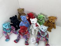 Full view of all 10 Ty Beanie Babies bears in assorted colors and patterns, showing original tags attached for each bear.