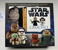 Front view of unopened Star Wars Crochet Kit box featuring crocheted Star Wars characters including Yoda and Stormtrooper with text stating 12 projects and included materials.
