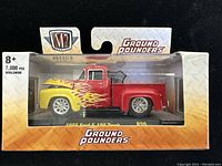 Front and side view of the unopened 1956 Ford F-100 diecast model in packaging