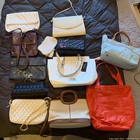 Overview of all 12 bags showing varied materials and colors arranged on a dark surface.