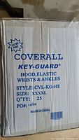 Box labeled 'Coverall Key-Guard' Size XXXXL, 25 quantity, latex-free, style CVL-KG-HE