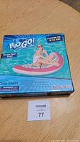 Box showing H2O Go Dragon Fruit Float with image of person using float in pool, brand Bestway visible.