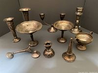 Group of ten mixed silver pieces arranged on flat surface