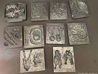 Photo of 10 assorted Creepy Crawler metal molds laid out on a surface showing various creepy and insectoid shapes