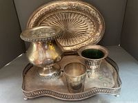 Overall photo of silver plated gallery tray with vases and miniature ice bucket on it