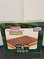 Front view of the Coleman ComfortSmart Quickbed double size air mattress box showing product branding and air mattress image.