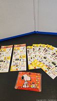 Complete lot showing the Snoopy Ice Cream Parlour portfolio and multiple sheets of Snoopy Hallmark stickers, including two sealed sticker packages.
