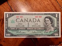 Front view of the 1867-1967 Canadian Centennial One Dollar banknote showing detailed design with bilingual text and Queen Elizabeth II portrait.