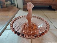 Front view showing ribbed bowl, beaded rim and frosted figurine