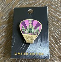 Single pin on black card with 'LIMITED EDITION' text, showing pink and gold statue design with four horses and a chariot, labeled Hard Rock 50th.
