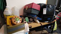 View of two humidifiers, citronella coil, and other items arranged on a workbench