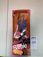 Front of original sealed box showing Ken figure and Barbie branding