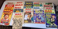 Top view of MAD Magazine issues including MAD Specials with covers showing caricatures and pop culture references